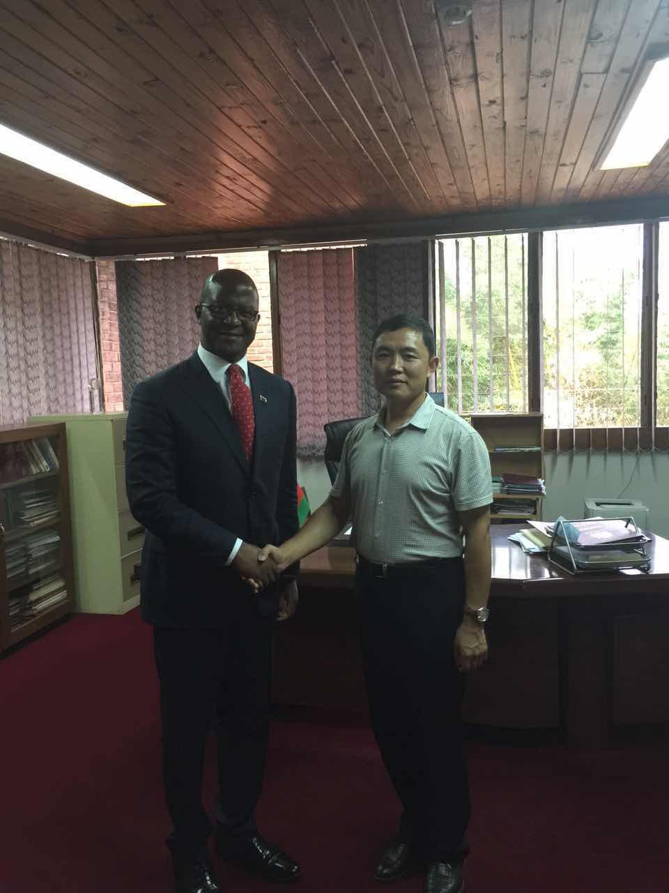 Photo of Mr. MA Zhanjiang and the Minister of Land
